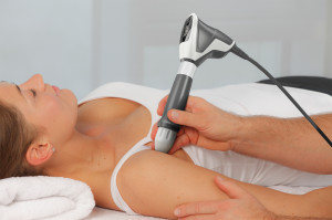 Shockwave therapy being applied to a patient